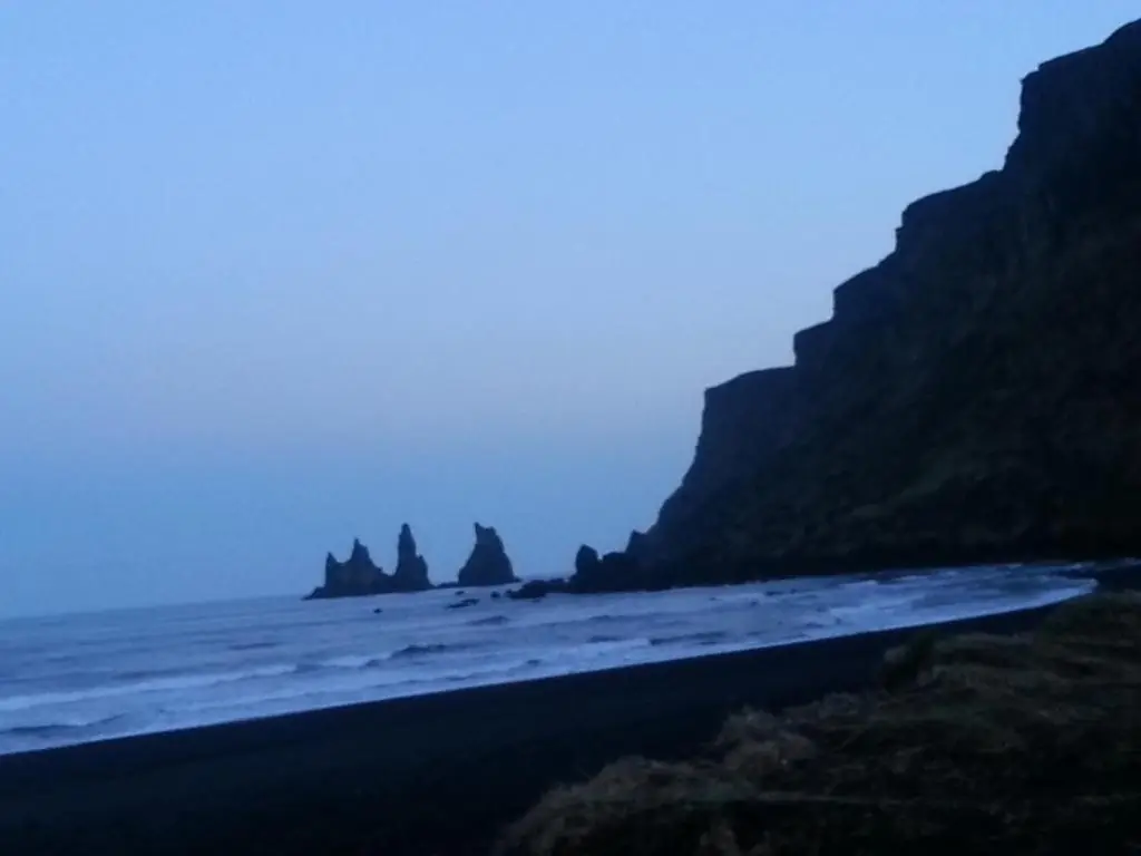 Reynisdrangar sea stacks and black sand beach near Vík, Iceland
